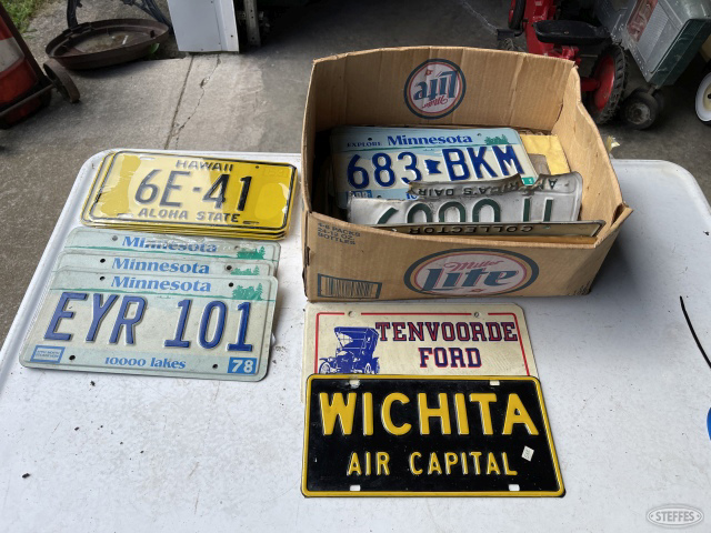 box of vintage license plates